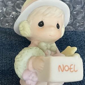 Dusty boy with box of ornaments figurine